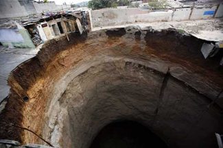 Guatemala City Sinkhole on Guatemala Swallowed More Than Ten Houses On Friday  This Huge Sinkhole