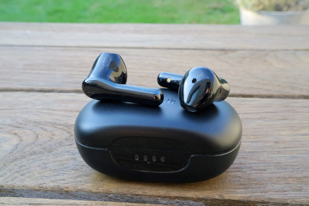 Flybuds C2 charging case with earbuds on top